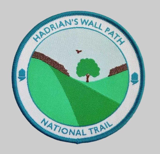 Hadrian's Wall Path National Trail patch with green landscape and blue border on a white background