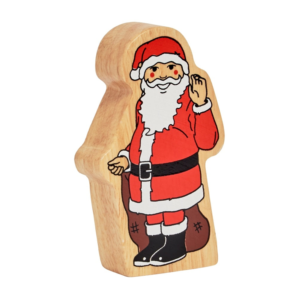 Wooden toy figure of Santa Claus on a white background