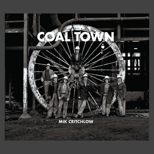 Book cover of 'Coal Town' by Mik Crichtlow featuring a group of men in front of a large wheel.