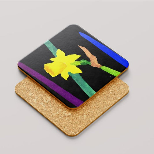 Coaster with a yellow daffodil flower design on a black background