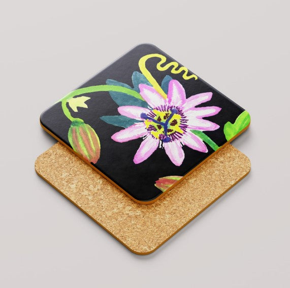 Coaster with a colorful passionflower design on a black background
