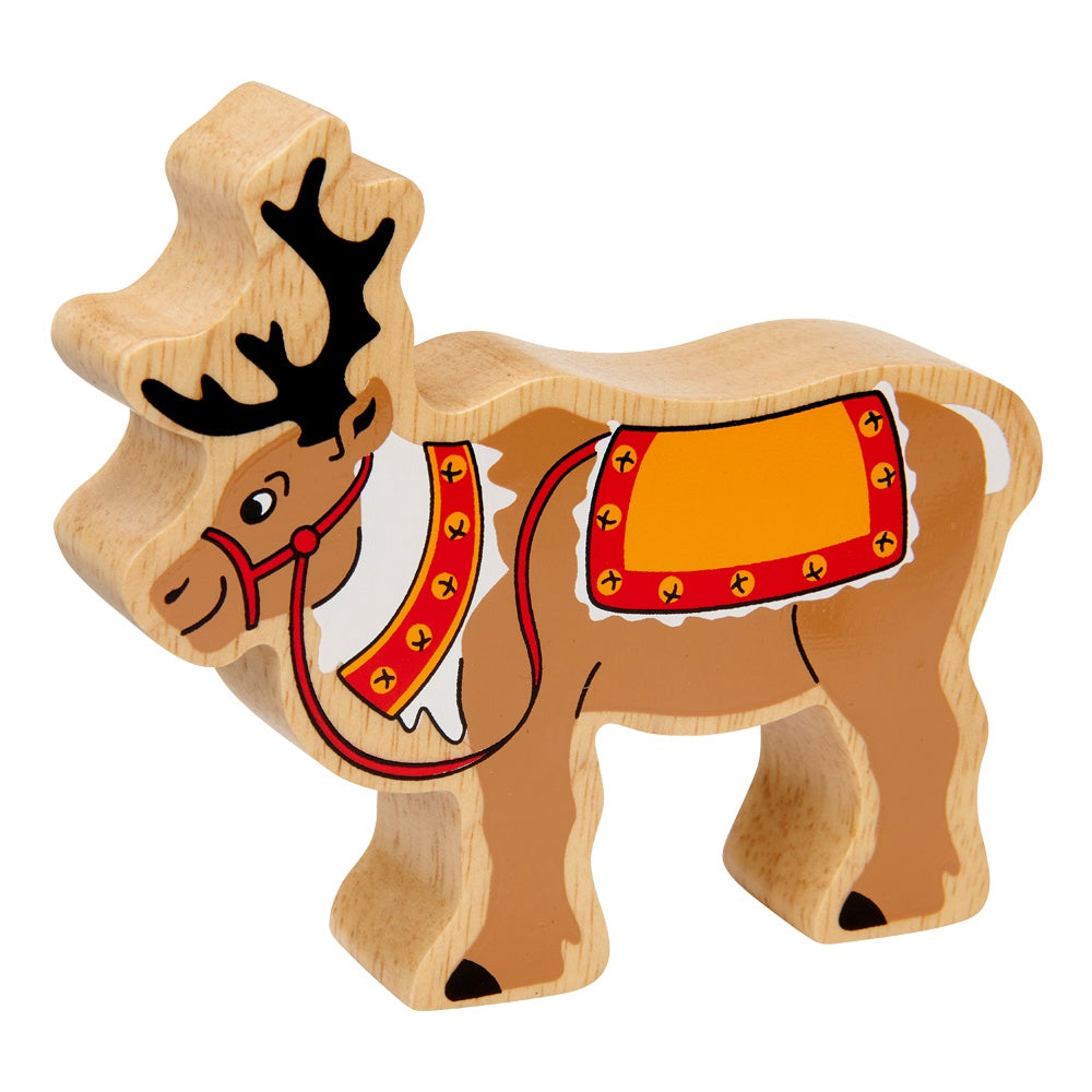 Wooden reindeer toy with a red harness and saddle blanket on a white background